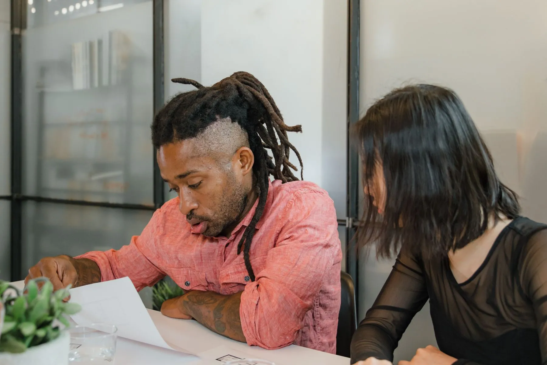 Two colleagues reviewing a change to a live application