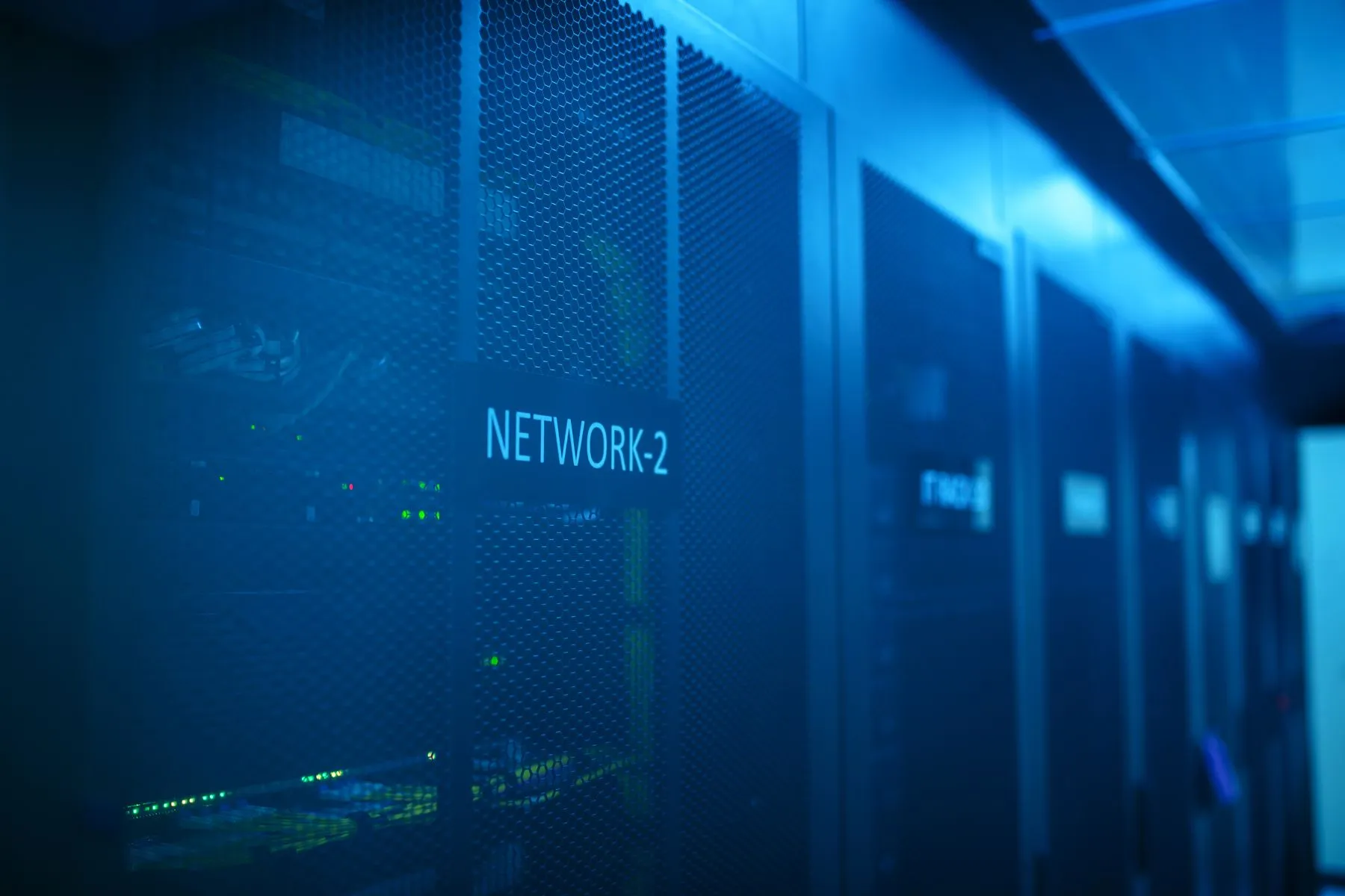 A monitored server hall lit in blue